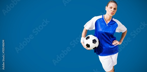 Composite image of portrait of woman football player is posing 