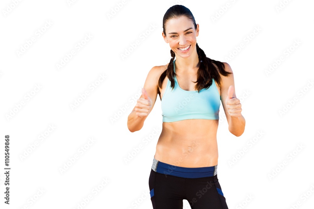 Portrait of sporty woman smiling with thumbs up Portrait of sporty woman smiling with thumbs up