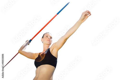 Low angle view of sportswoman is practising javelin throw 