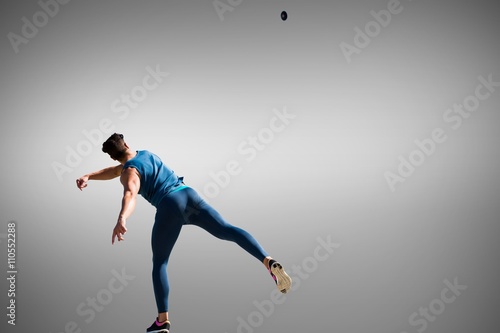 Composite image of man throwing discus against white background