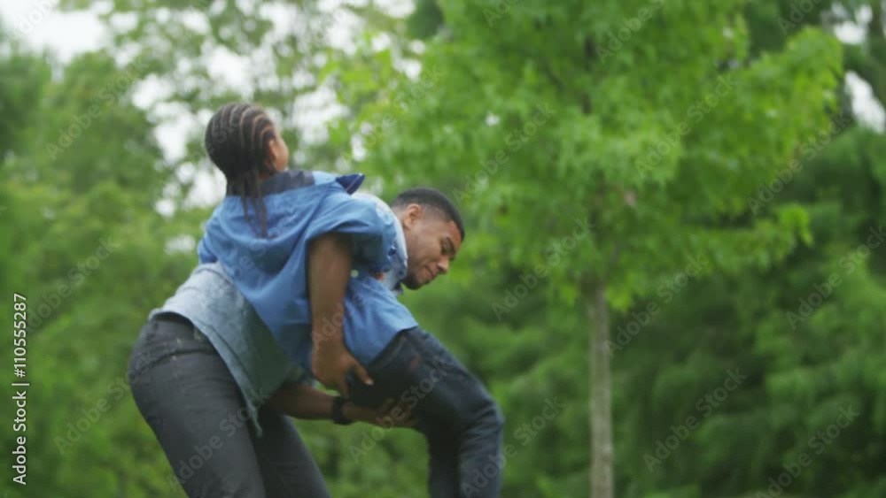 Happy African American father & son having fun in the park. Happy African American father & son having fun in the park.