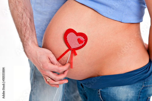 Wallpaper Mural pregnant woman's belly with a heart Torontodigital.ca