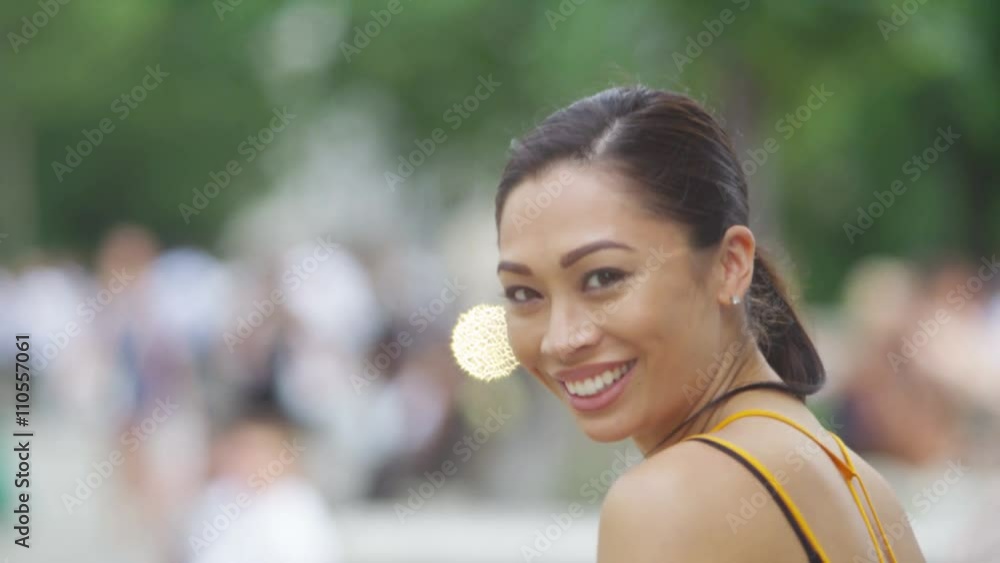 Portrait of beautiful woman smiling to camera outdoors in the city Portrait of beautiful woman smiling to camera outdoors in the city