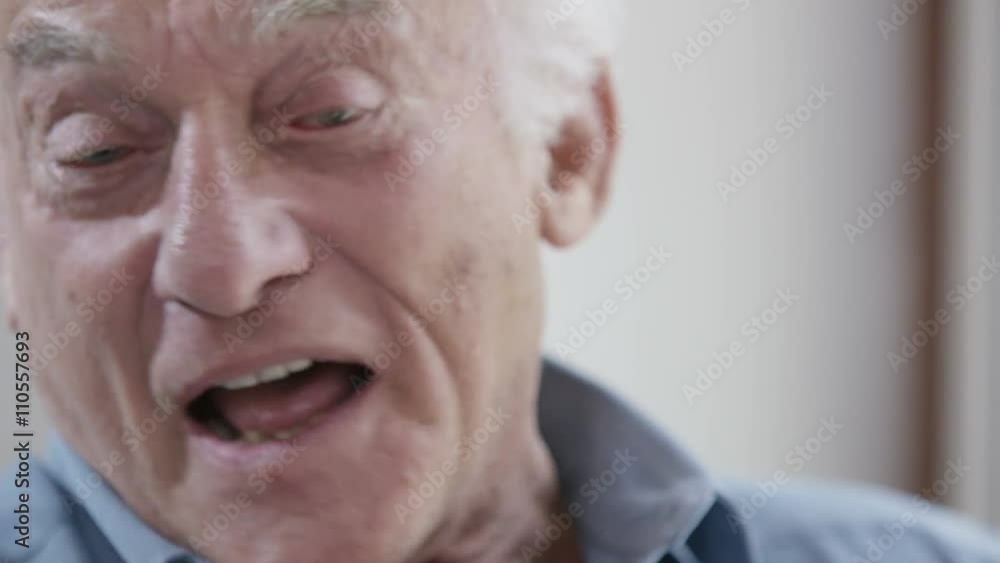 Close up portrait of elderly man laughing Close up portrait of elderly man laughing