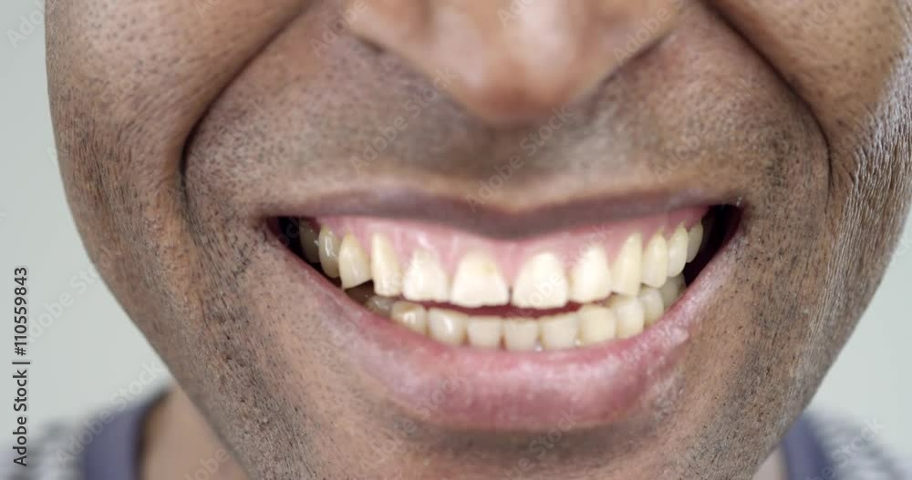 Extreme Close-Up of a Smile of an Afro-American Man/The African American is smiling. His smile is wide and happy. Extreme Close-Up of a Smile of an Afro-American Man/The African American is smiling. His smile is wide and happy.