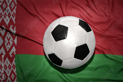 black and white football ball on the national flag of belarus