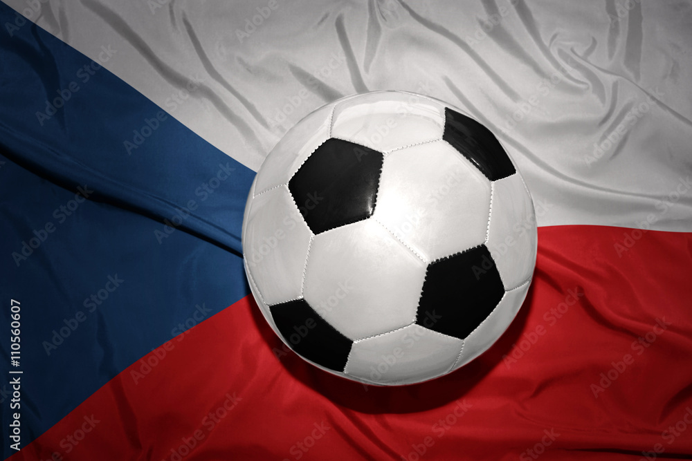 Naklejka premium black and white football ball on the national flag of czech republic