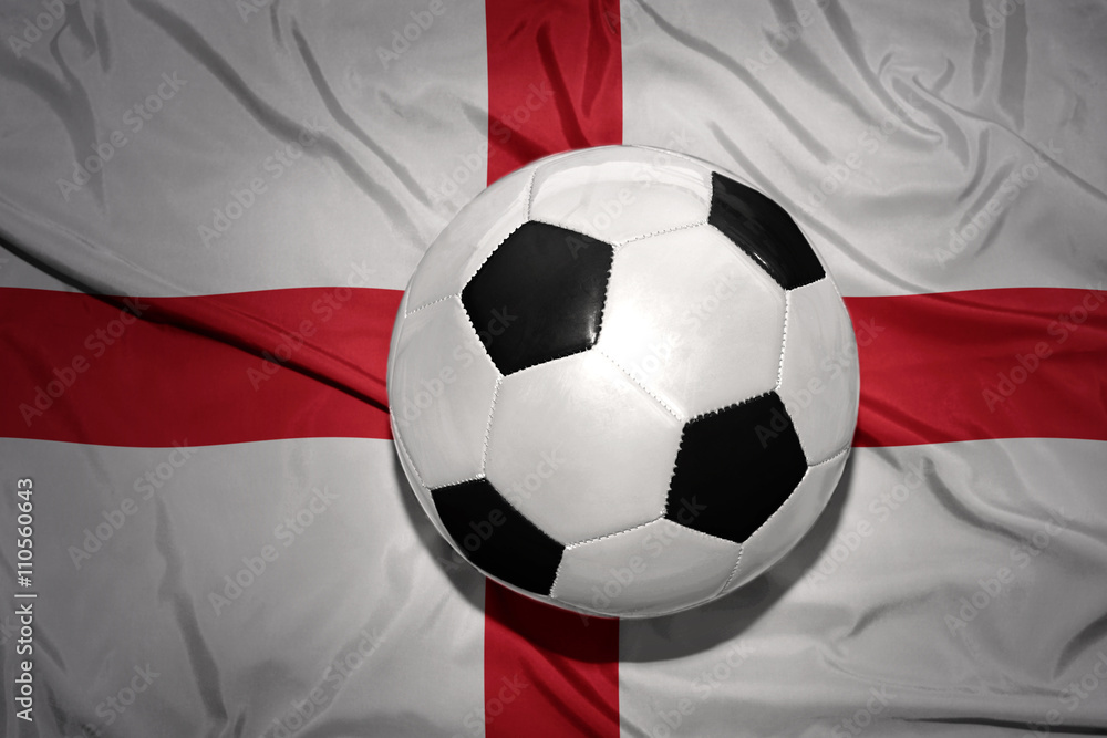 black and white football ball on the national flag of england black and white football ball on the national flag of england