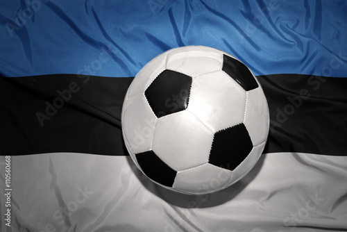 black and white football ball on the national flag of estonia