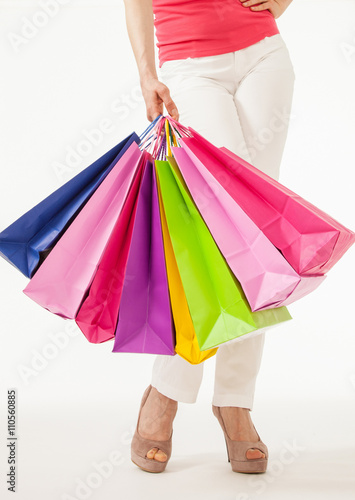 Woman holding  multicolored shopping bags