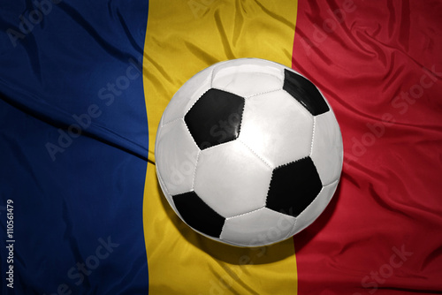 black and white football ball on the national flag of romania