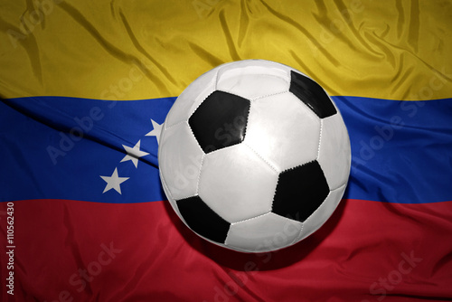 black and white football ball on the national flag of venezuela