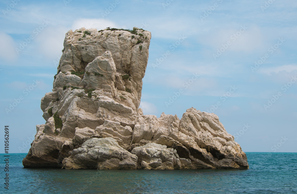 One of the Two Sister (Due Sorelle) reef, in the Conero Mountain , adriatic sea, Italy. Blue sky background in thee summer season. One of the Two Sister (Due Sorelle) reef, in the Conero Mountain , adriatic sea, Italy. Blue sky background in thee summer season.