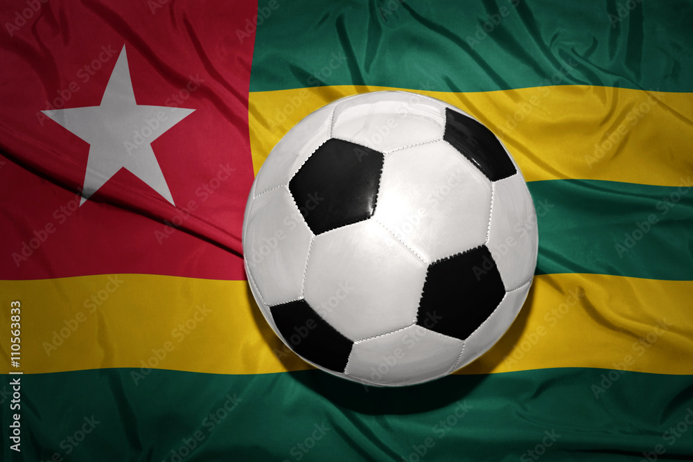 black and white football ball on the national flag of togo black and white football ball on the national flag of togo