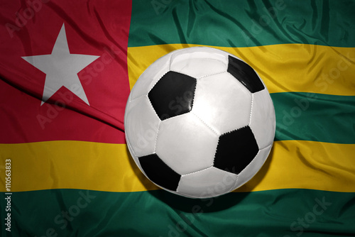 black and white football ball on the national flag of togo