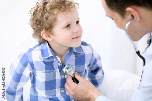 Doctor examining a child patient by stethoscope