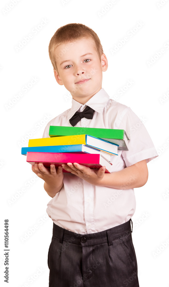 The pupil on white background holds pile of books The pupil on white background holds pile of books