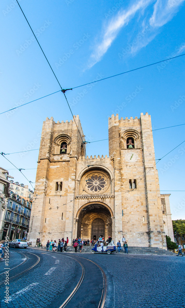 Se (Lisbon Cathedral) with a traditional yellow tram in Lisbon,