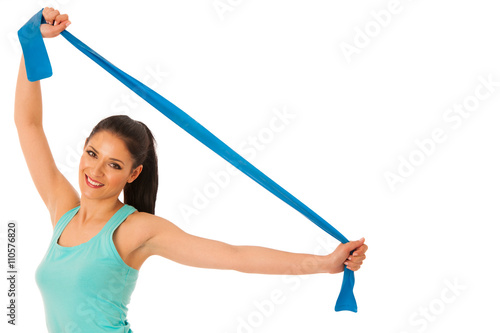 Woman working out with band in fitness gym isolated over white