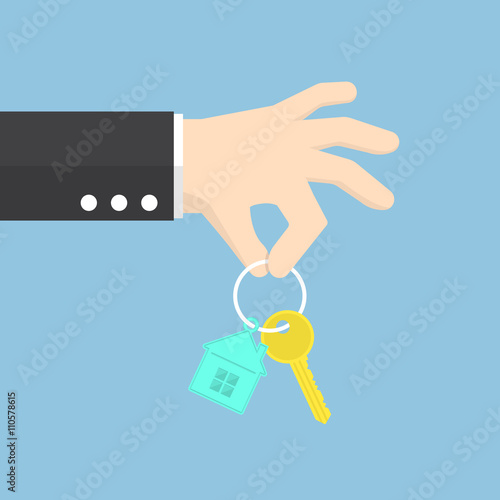 Hand holding a house key