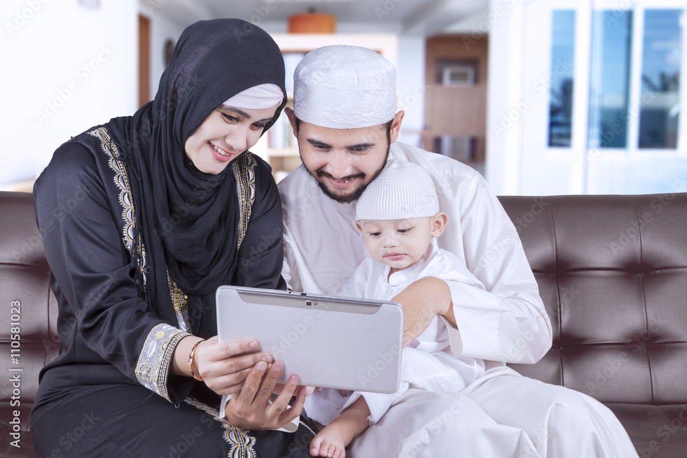 Middle eastern family using tablet at home Middle eastern family using tablet at home
