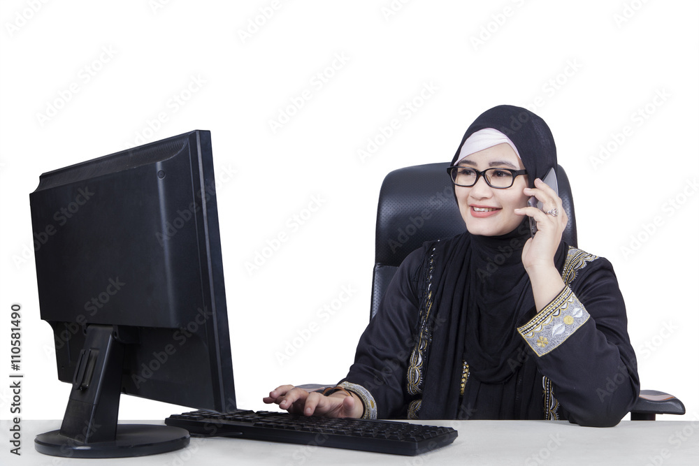 Muslim businesswoman talking on the phone Muslim businesswoman talking on the phone