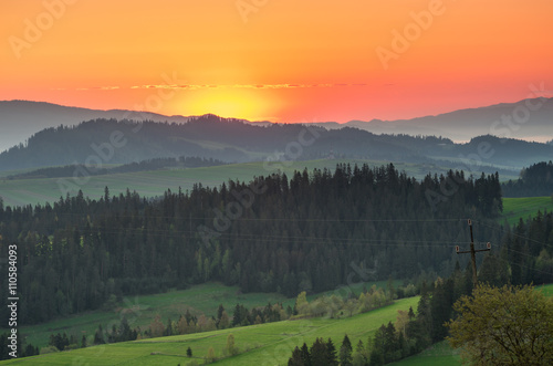 Moments before sunrise in misty Carpathian mountains, spring, Poland