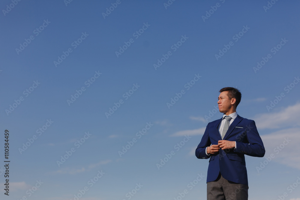 Korean businessman against the sky Korean businessman against the sky