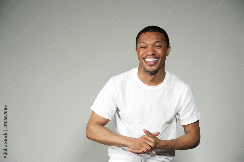 Trendy Happy and Fun Black Male Wearing A White Top Trendy Happy and Fun Black Male Wearing A White Top