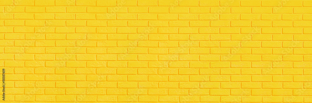 Naklejka premium Yellow brick wall background