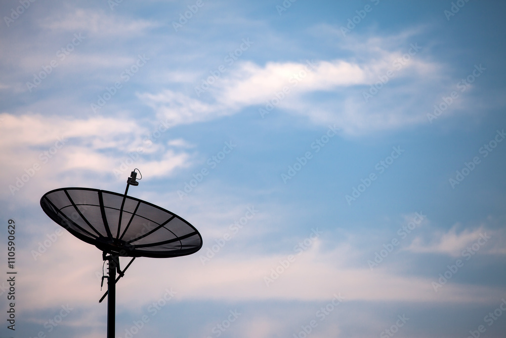 Satellite dish on the blue sky background.