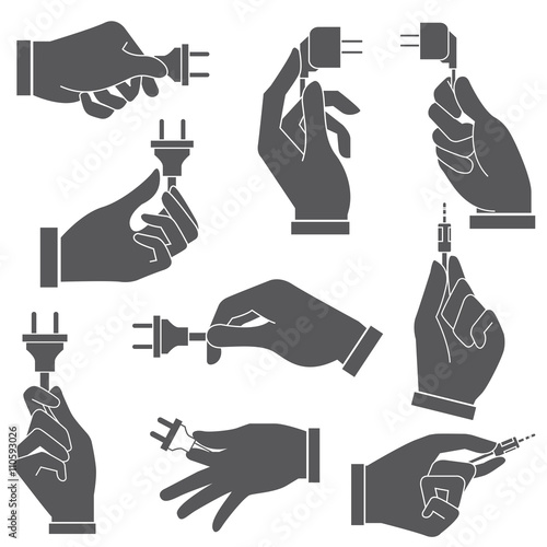 hand holding electric plug