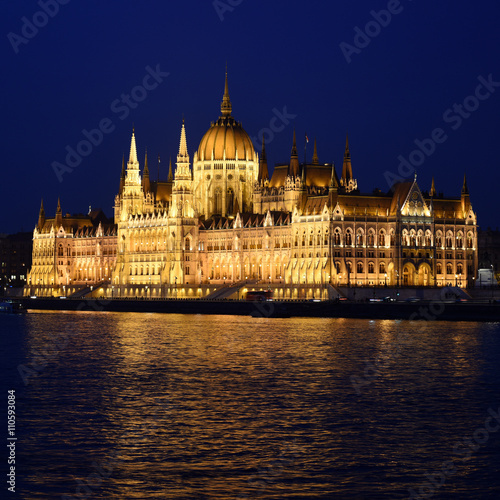 Budapest Parliament in Hungary at night on the Danube river