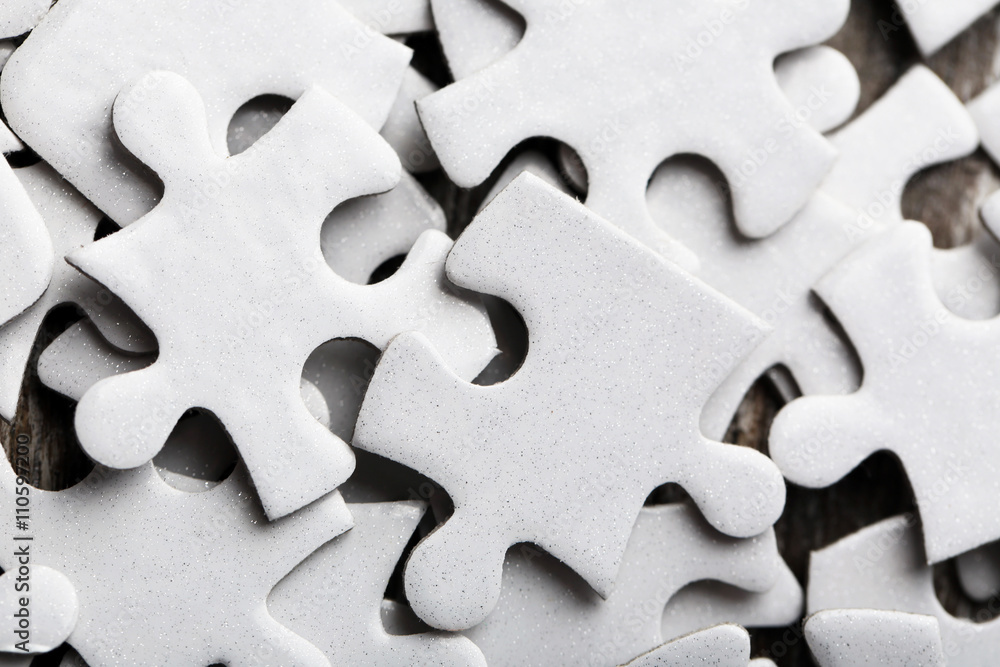 Puzzles on wooden table, closeup Puzzles on wooden table, closeup