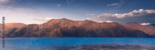 india, It is 134 km long and extends from India to Tibet. Leh, Jammu and Kashmir, ladakh, Pangong tso (Lake) with blue sky in background. It is huge lake in Ladakh, scenic