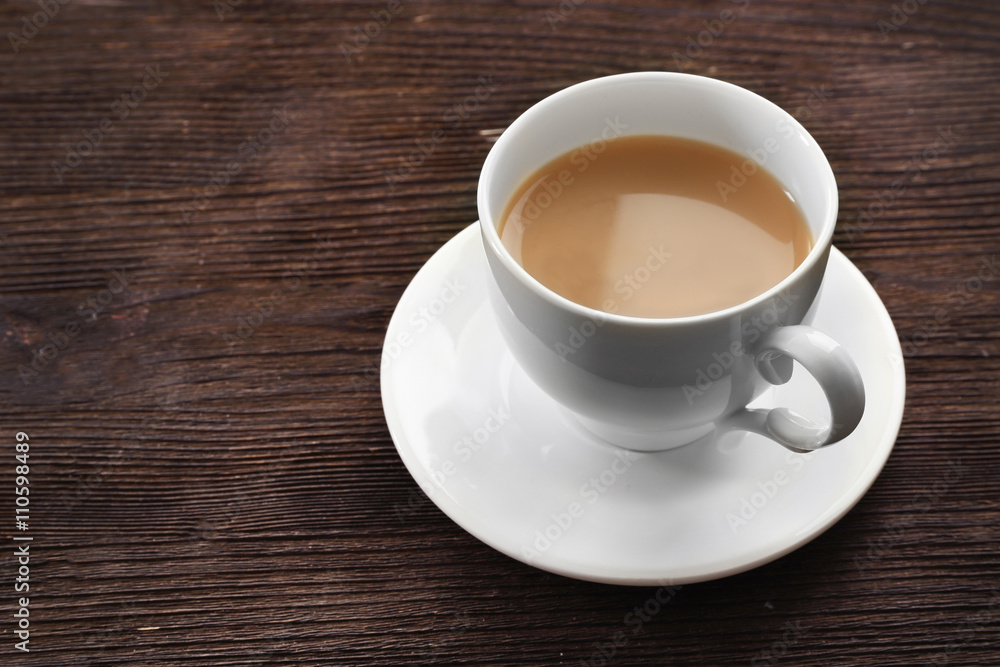 Milk tea on wooden background.