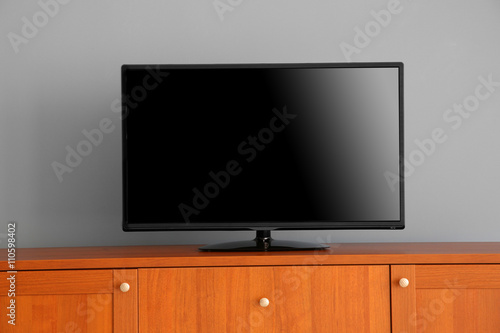 wide screen TV on wooden co...