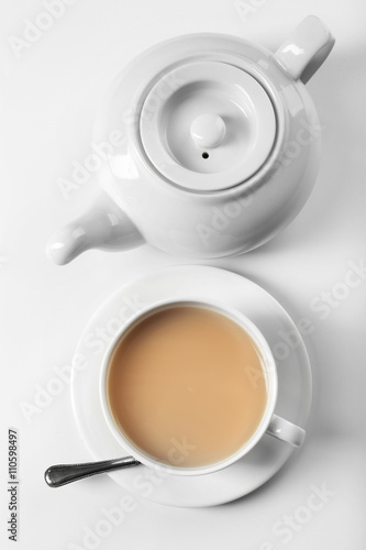 Milk tea with tea pot on white background