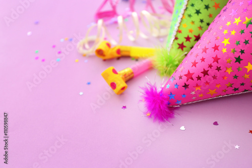 Party hats on pink background © Africa Studio