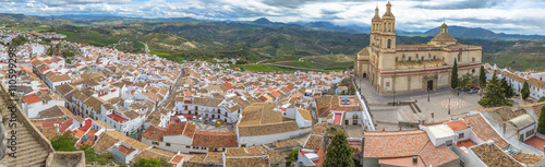 Panorama of Olvera and Cathedral seen from the Castle of the famous village de la Ruta de los Pueblos Blancos, white villages, between Cadiz and Malaga, Andalusia, Spain. photo