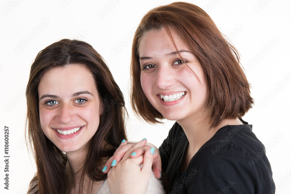 Confident Young and beautiful sisters in friendship isolated Confident Young and beautiful sisters in friendship isolated