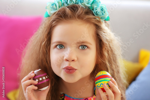 Little girl with Easter egg...