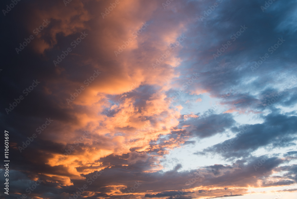 Dramatic sunset sky with orange cloud colors