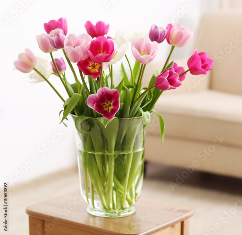 Bouquet of beautiful tulips in room interior