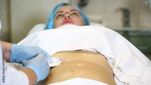woman is in the process cellulite mesotherapy clinic