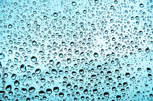 Water texture in blue with large drops photo