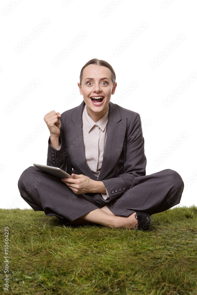 business female sittting on grass business female sittting on grass