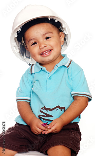 Smiling little boy wearing helmet,