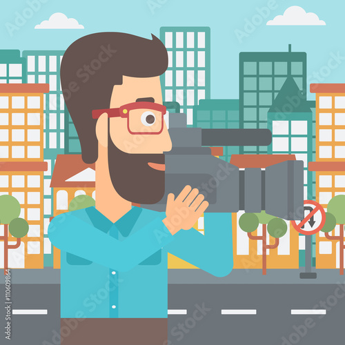 Cameraman with video camera.