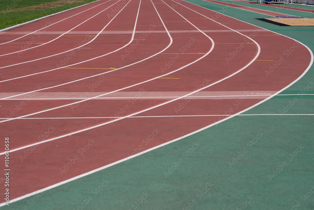 The running ways at the stadium with artificial coating of rubber 